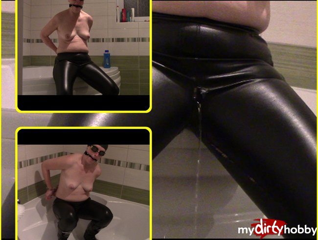 Pissing in leaky leather jeans