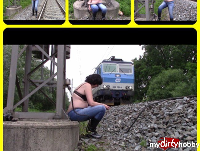 At the railway tracks in wet jeans and with handcuffs